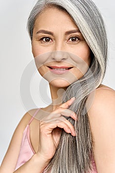 Senior happy middle aged mature asian woman headshot portrait. Skincare ads.