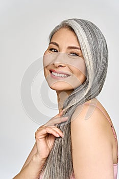 Senior happy middle aged mature asian woman headshot portrait. Spa advertising.