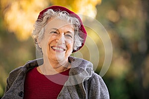 Senior happy woman in autumn