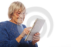 Senior happy woman using ipad