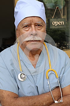 Senior health care worker with scrubs and stethoscope