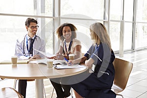 Senior healthcare workers in consultation in a meeting room