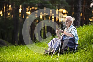 Senior Healthy Lifestyle Concepts. Portrait of Positive Mature Caucasian Woman Having Fitness Nordic Walking Exercise with