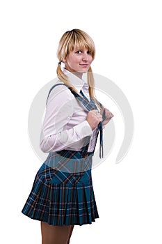 Senior high school girl in uniform is posing