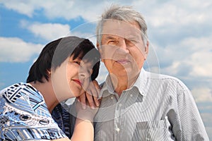 Senior, his daughter leaning to shoulder