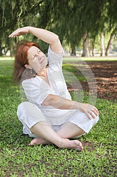 Senior Hispanic woman practicing yoga. Wellness, active and healthy lifestyle
