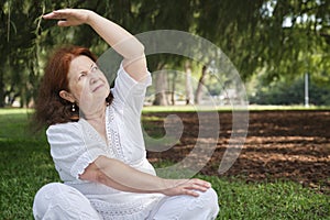 Senior Hispanic woman practicing yoga. Wellness, active and healthy lifestyle