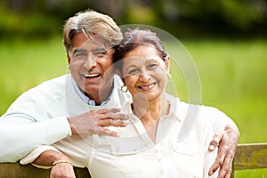 Senior Indian Couple Walking In Countryside