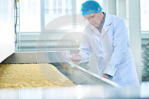 Senior Inspector Checking Quality at Food Factory