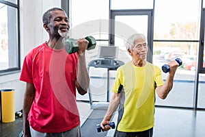 Senior interracial sportsmen working out with