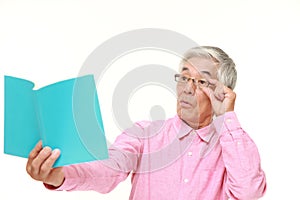 Senior Japanese man with presbyopia