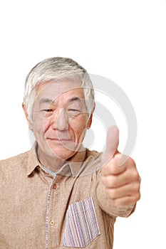 Senior Japanese man with thumbs up gesture