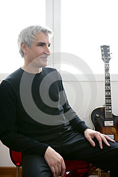 Senior jazz musician portrait, guitar