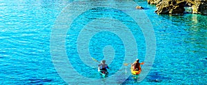 Senior kayaker on a kayak by the sea, active water sport and lei