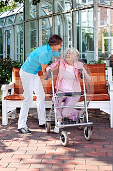 Senior lady with a care assistant or her daughter