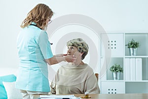 Senior lady examined by doctor