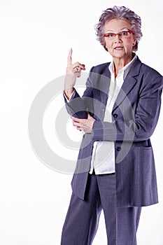 Senior lady with index finger upwards