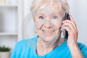 Senior lady talking on cellular phone