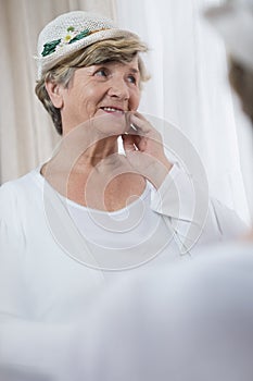 Senior lady wearing boater photo