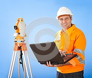 Senior land surveyor with theodolite