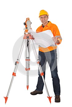 Senior land surveyor with theodolite