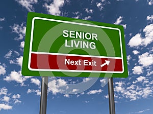 senior living next exit traffic sign on blue sky