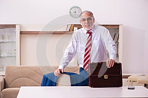 Old male boss employee coming home from work