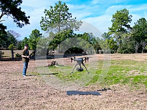 Senior male Drone pilot taking off and flying a Drone