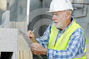 Senior male engineer in construction site photo