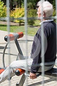 Senior male exercising in park