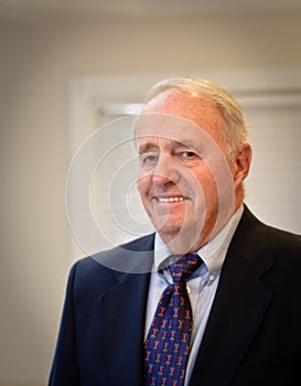 Senior Male formally dressed in suit and tie photo