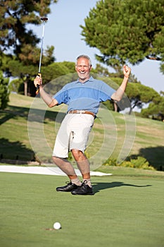 Senior Male Golfer On Golf Course