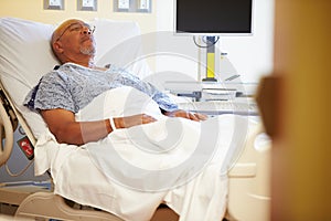 Senior Male Patient Resting In Hospital Bed