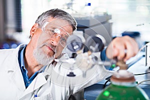 Senior male researcher carrying out scientific research in a lab