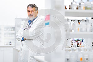 Senior male researcher carrying out scientific research in a lab