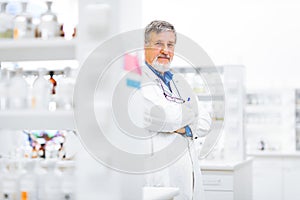 Senior male researcher carrying out scientific research in a lab