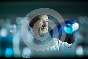 Senior male researcher carrying out scientific research in a lab