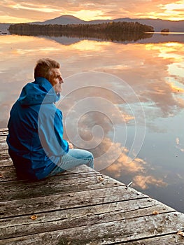 Senior Male at Sunset on Memphremagog Lake, Quebec, Canada