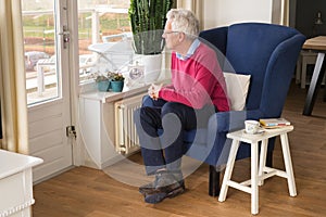 Senior man alone in interior