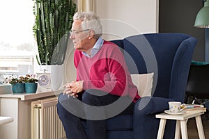 Senior man alone in interior photo