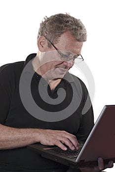 Senior man answering e-mail