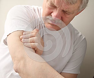 Senior man with arm pain