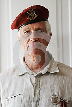 Senior man, army and veteran in portrait for memories, pride and respect in home for remembering. Mature person, war and
