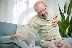 Senior man bad pain hand touching chest having heart attack