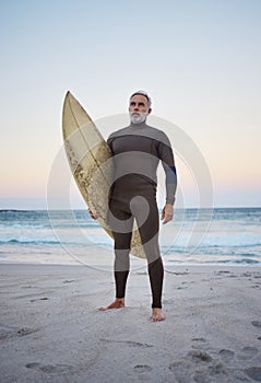 Senior man on beach, summer surfing vacation and holiday travel fitness adventure on Australia shore. Sunset sky with