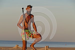 Senior man with beard at beach photo