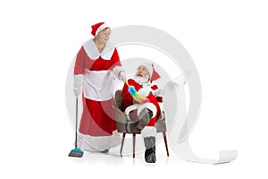 Senior man and beautiful middle-aged woman, Santa Claus and missis Claus in traditional New Year costume isolated on