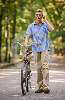 Senior man with bicycle