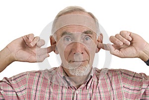 Senior man blocking ears