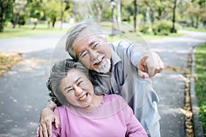 Senior man caring for  disabled wife